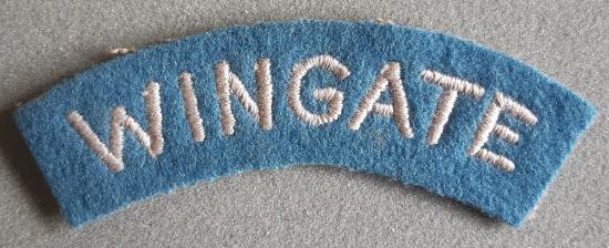 BRITISH WW2 “WINGATE” Embroidered Shoulder Title (White on Pale Blue)