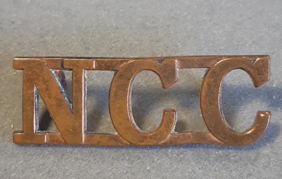 BRITISH Shoulder Title “N.C.C” (Non-Combatant Corps) - Bronze