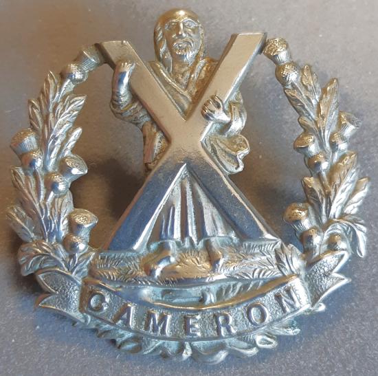 BRITISH - The Queen's Own Cameron Highlanders White Metal Badge.