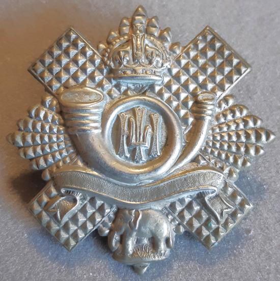 BRITISH - Highland Light Infantry White Metal Hat Badge (Blank Wide Scroll)- Territorial Bns.