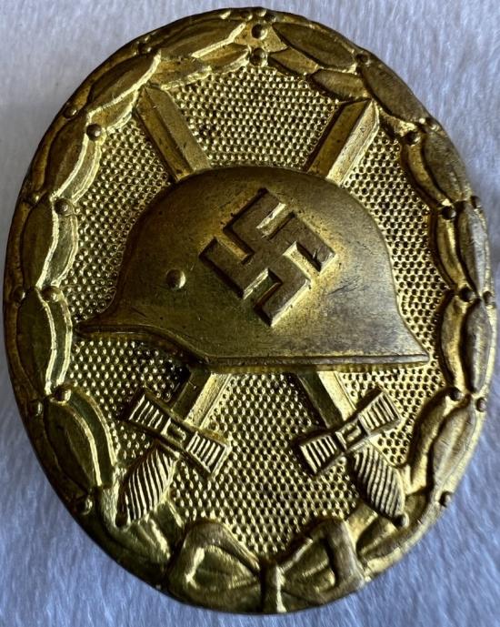 POST WW2 PRODUCED GERMAN GOLD WOUND BADGE - MARKED L/63